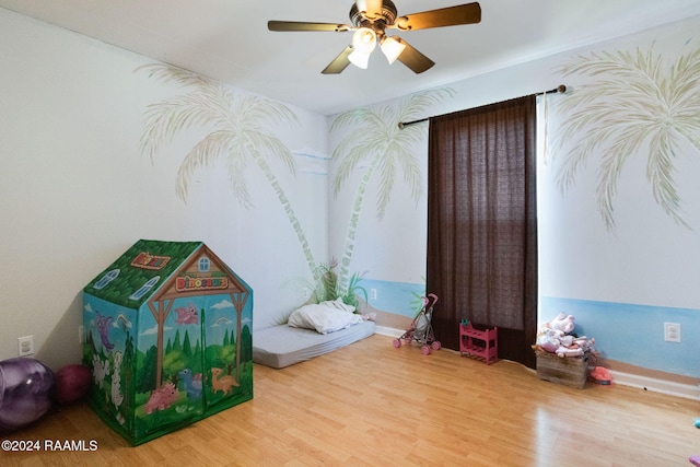 recreation room featuring ceiling fan and wood-type flooring