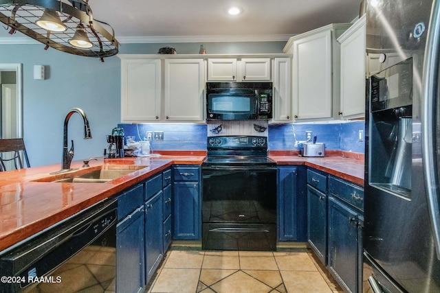 kitchen with blue cabinetry, white cabinetry, sink, crown molding, and black appliances