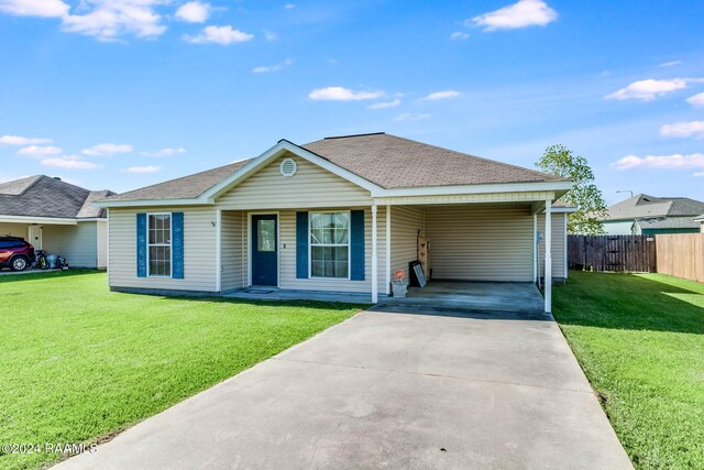 single story home featuring a front yard and a carport