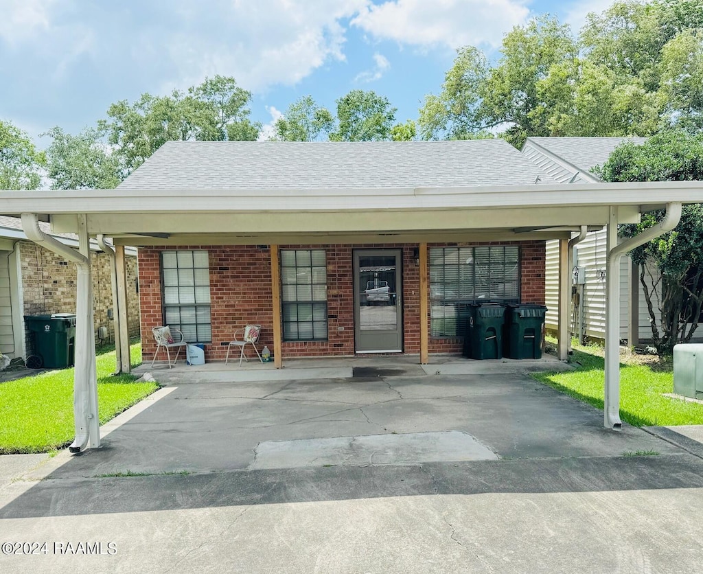 exterior space with a carport