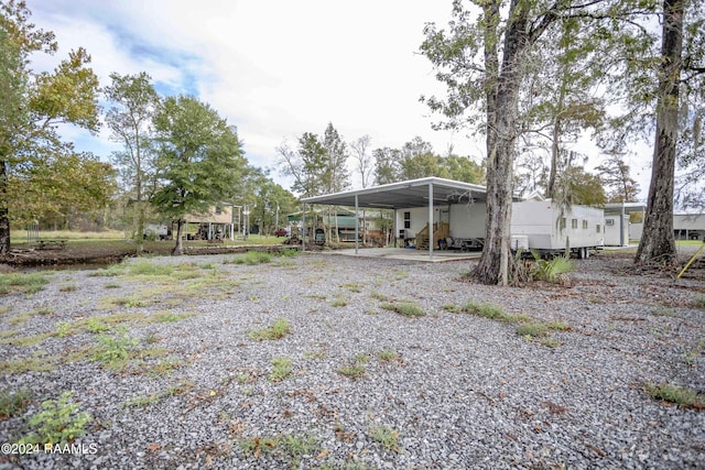 exterior space with a carport