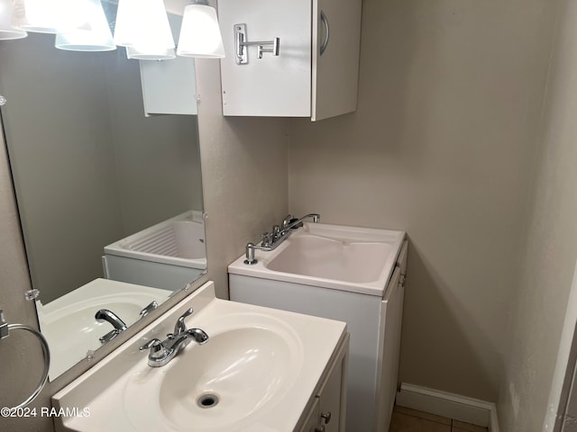 bathroom with tile patterned flooring and vanity