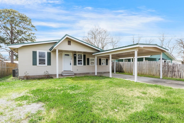 bungalow-style house with fence, entry steps, a carport, a front lawn, and aphalt driveway