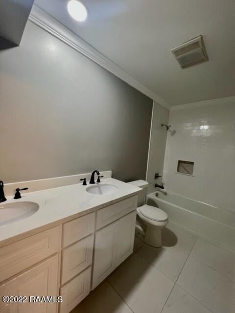 full bathroom featuring tile patterned flooring, vanity, toilet, and tiled shower / bath