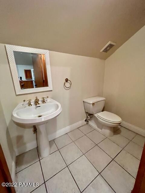 bathroom featuring tile patterned floors and toilet