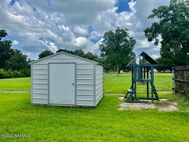 view of outbuilding with a lawn