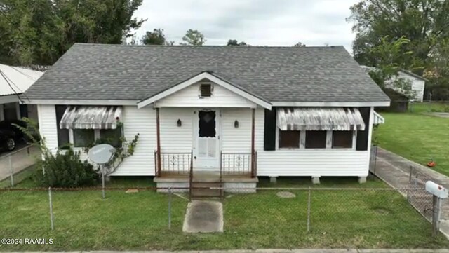 bungalow with a front lawn