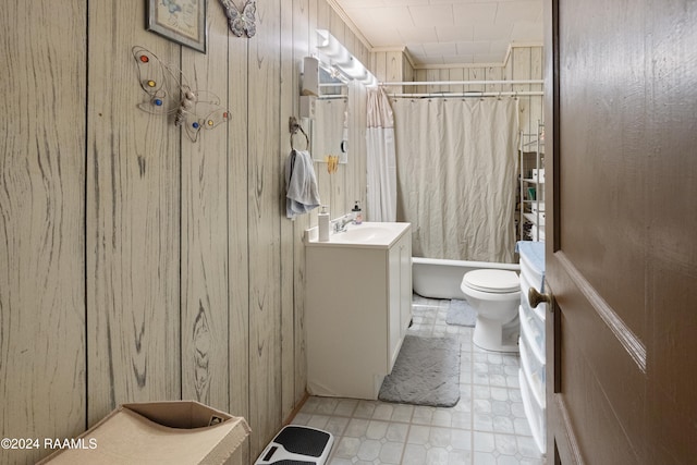 full bathroom with shower / bath combination with curtain, vanity, toilet, and wood walls