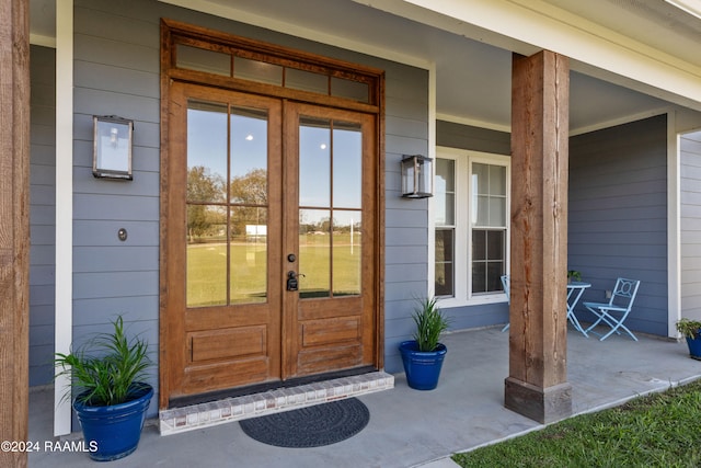 doorway to property with french doors and covered porch