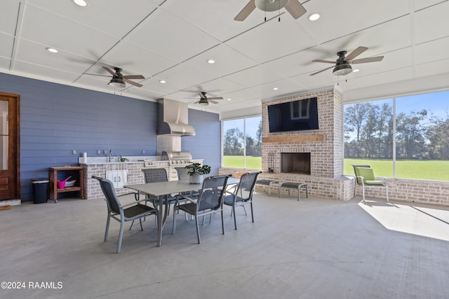 view of patio / terrace featuring an outdoor brick fireplace