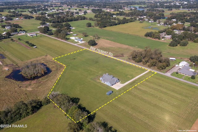 birds eye view of property with a rural view