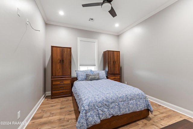 bedroom with ceiling fan, light wood-type flooring, and ornamental molding