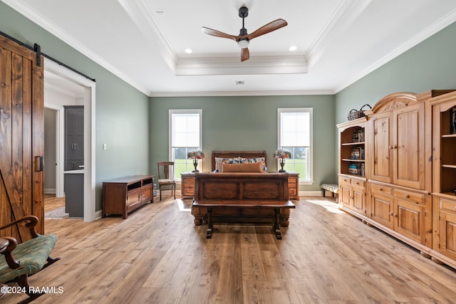 bedroom with light hardwood / wood-style floors, multiple windows, and crown molding