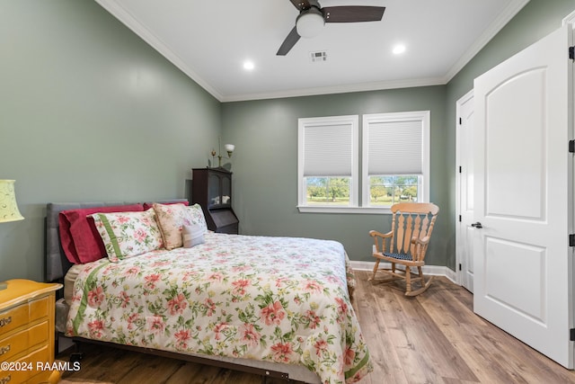 bedroom featuring ceiling fan, crown molding, and light wood-type flooring