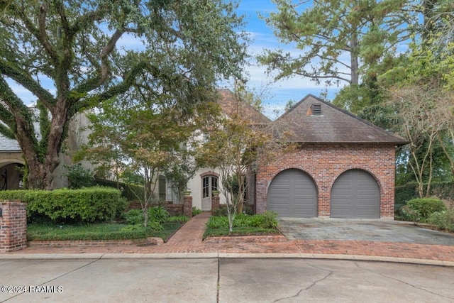 106 Kings Walk, Lafayette, LA 70503 - view of front facade with brick siding, driveway, a garage, and a shingled roof