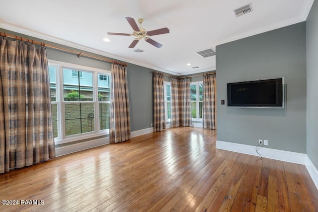 unfurnished living room with ceiling fan, light wood-type flooring, and crown molding