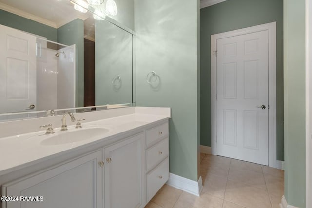 bathroom with vanity, walk in shower, tile patterned flooring, and ornamental molding