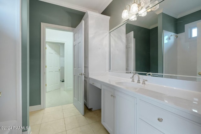 bathroom with a shower, tile patterned flooring, vanity, and ornamental molding