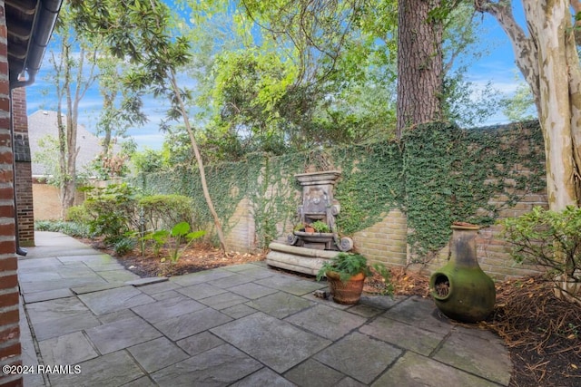 106 Kings Walk, Lafayette, LA 70503 - fenced backyard featuring a patio area