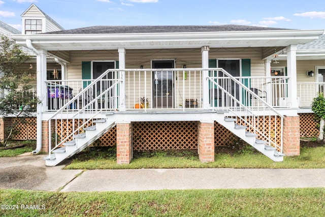 100 Teal Ln Unit 21, Lafayette, LA 70507 - rear view of house with stairway, covered porch, and roof with shingles