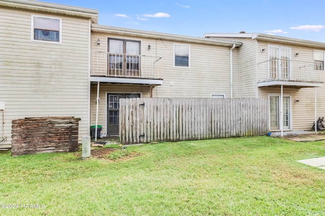100 Teal Ln Unit 21, Lafayette, LA 70507 - back of house with a balcony
