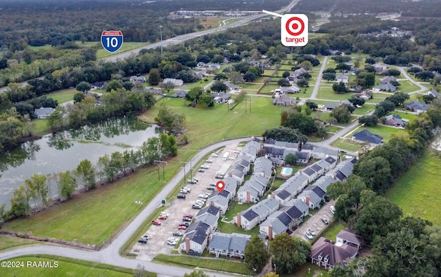 100 Teal Ln Unit 21, Lafayette, LA 70507 - aerial overview of property's location with a large body of water and nearby suburban area