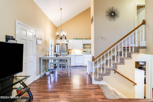 100 Teal Ln Unit 21, Lafayette, LA 70507 - foyer entrance featuring high vaulted ceiling, dark wood-style floors, stairway, and a chandelier