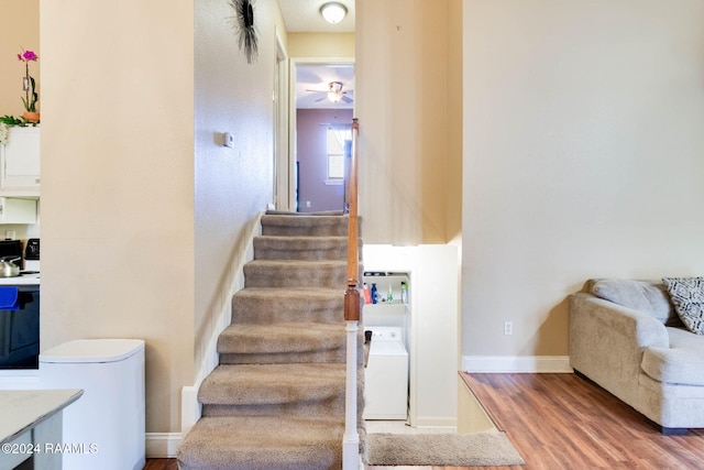 100 Teal Ln Unit 21, Lafayette, LA 70507 - staircase with wood finished floors, washer / dryer, baseboards, and ceiling fan