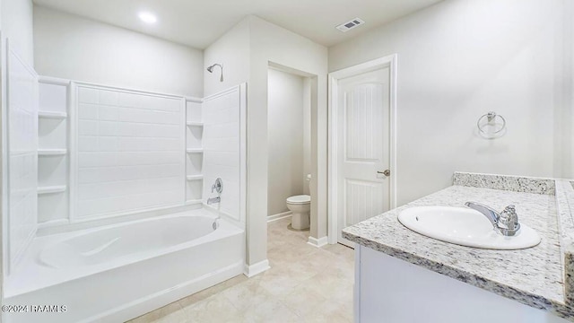 full bathroom featuring vanity, bathing tub / shower combination, and toilet