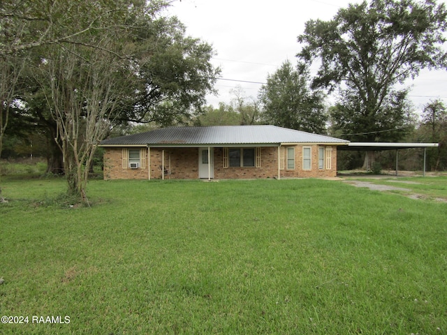 single story home with a carport and a front yard