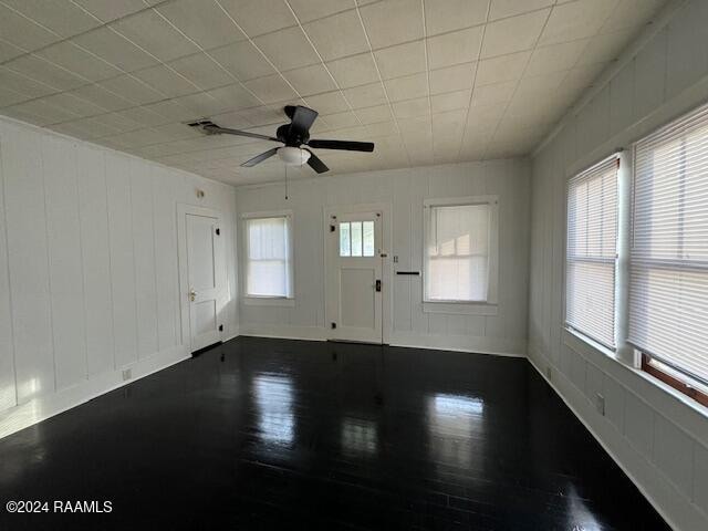 spare room featuring hardwood / wood-style flooring and ceiling fan