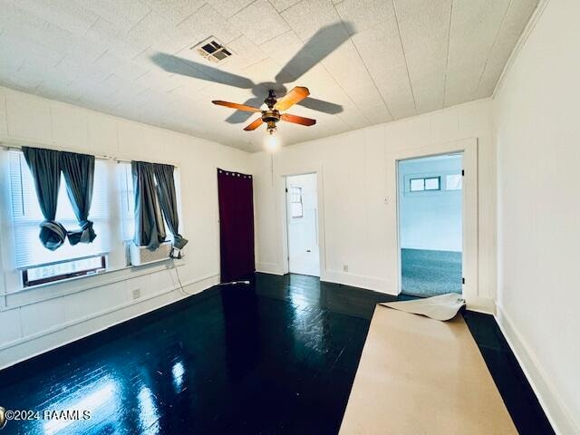 unfurnished room with ceiling fan