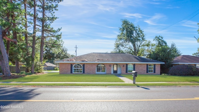 ranch-style home with a front yard