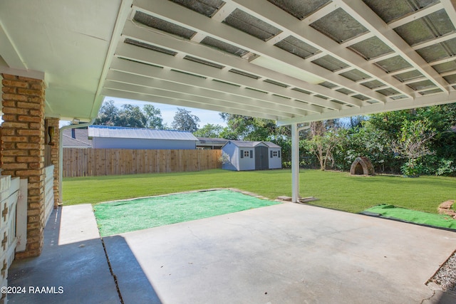 view of patio with a storage shed