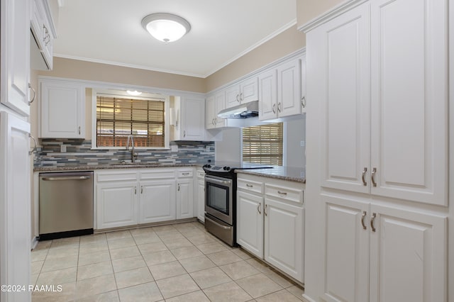 kitchen with stainless steel appliances, white cabinets, sink, and crown molding