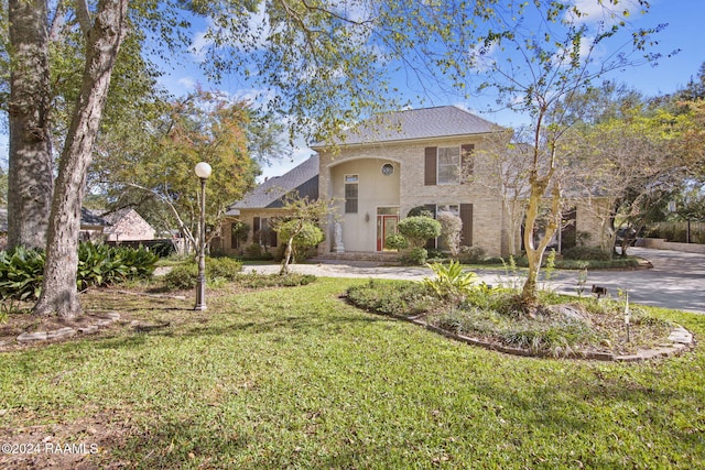 view of front of home with a front yard