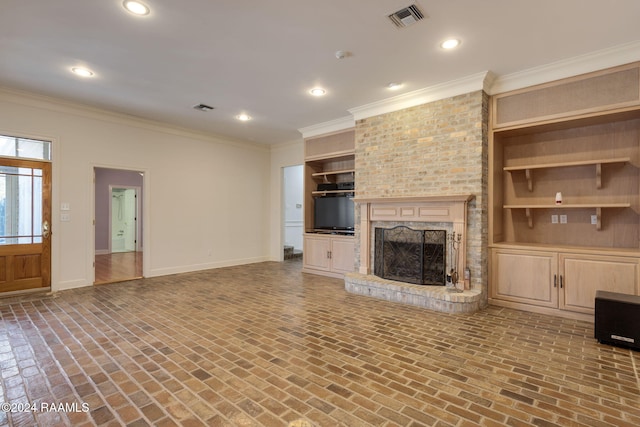 unfurnished living room with a brick fireplace and crown molding