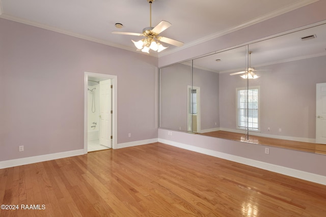 empty room with light hardwood / wood-style floors, ceiling fan, and crown molding