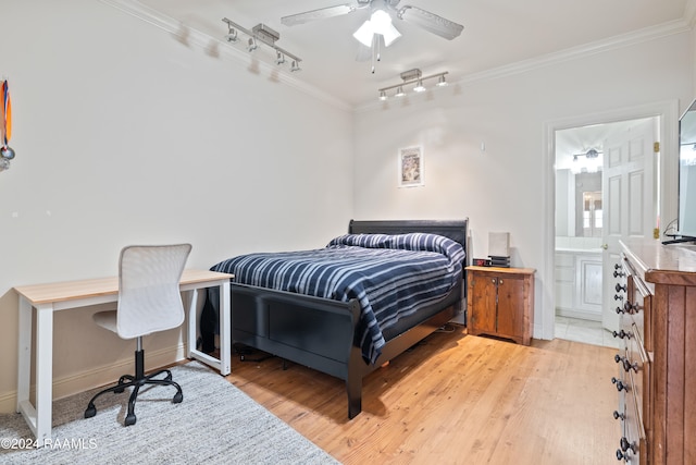 bedroom with ornamental molding, ceiling fan, light hardwood / wood-style floors, and ensuite bath