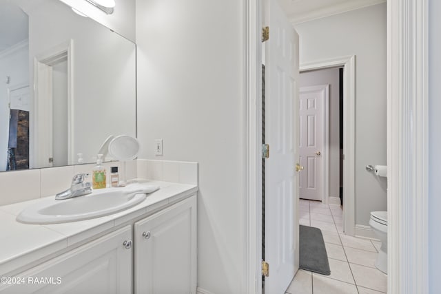 bathroom featuring ornamental molding, tile patterned flooring, vanity, and toilet