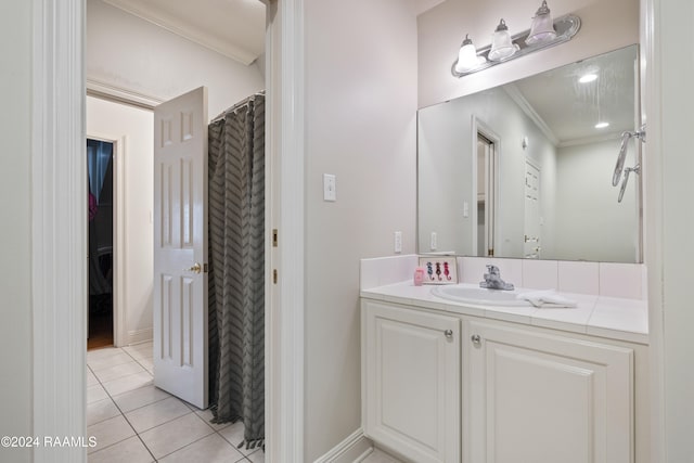 bathroom with vanity, tile patterned flooring, and ornamental molding