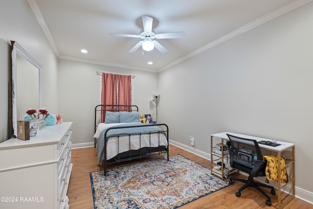 bedroom with light wood-type flooring, ceiling fan, and crown molding