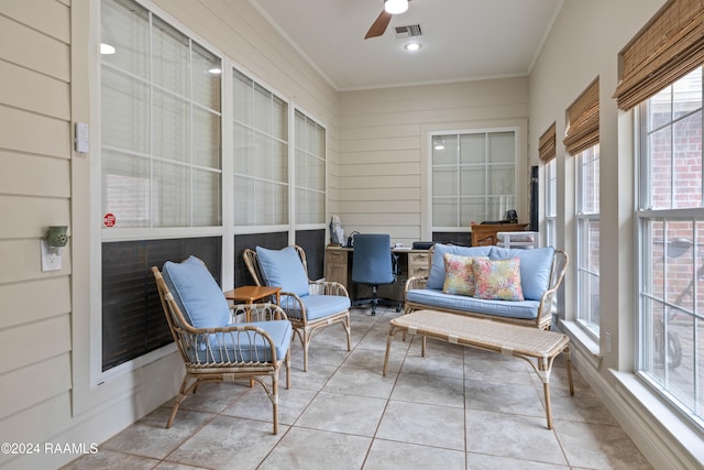 sunroom featuring ceiling fan