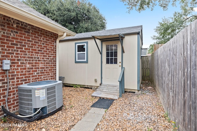 entrance to property featuring central AC