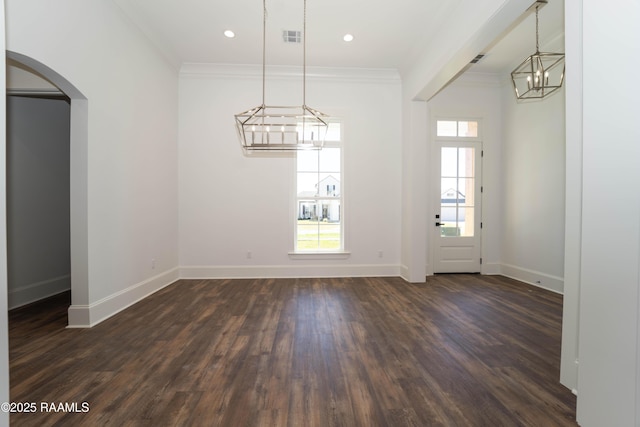 unfurnished dining area with dark wood-style floors, ornamental molding, visible vents, and baseboards