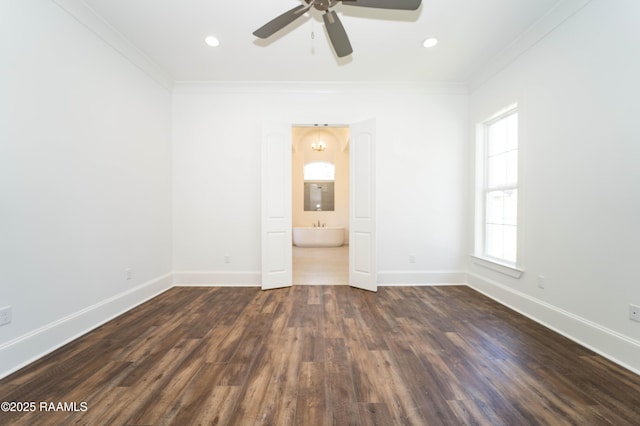 spare room featuring baseboards, dark wood finished floors, a ceiling fan, ornamental molding, and recessed lighting