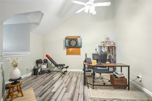 home office with ceiling fan, baseboards, vaulted ceiling, and wood finished floors