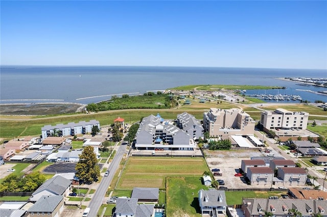 drone / aerial view with a water view and a residential view