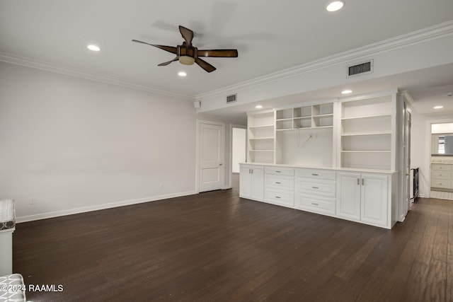 unfurnished living room featuring ceiling fan, dark wood-type flooring, and crown molding