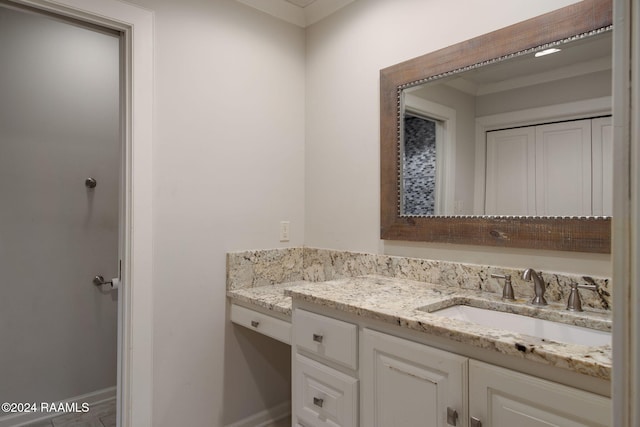 bathroom featuring vanity and ornamental molding